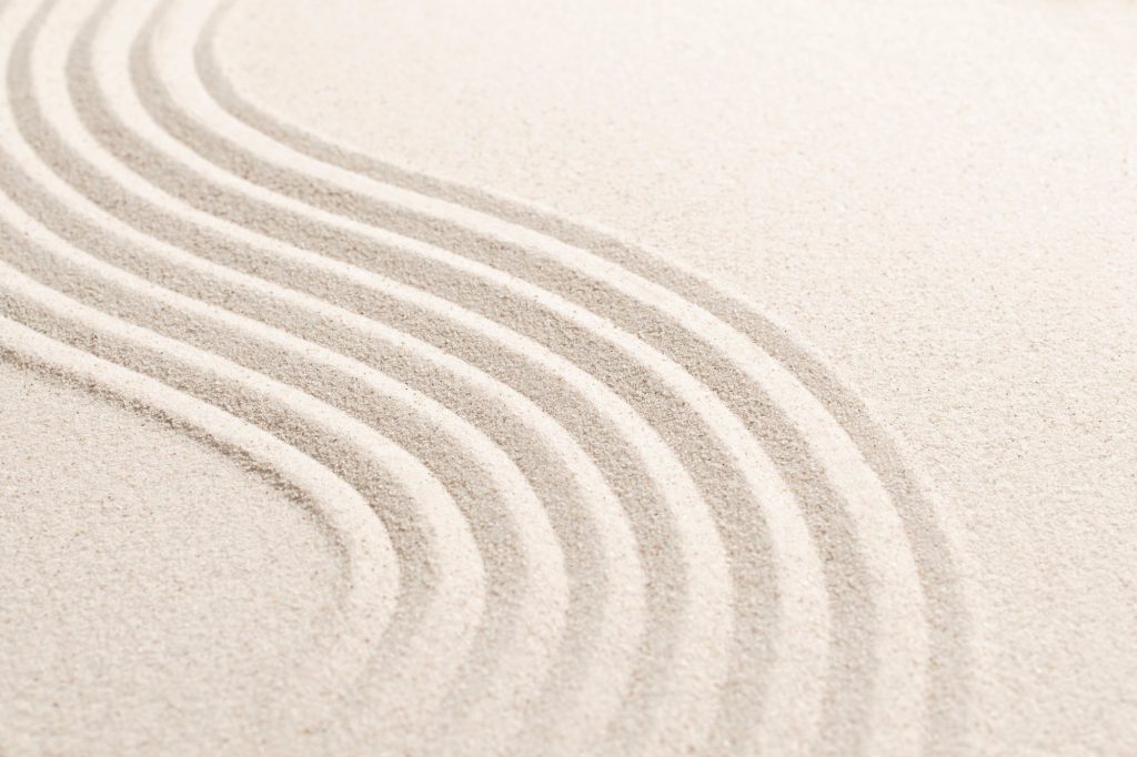 Sand wave nature textured background in wellness concept